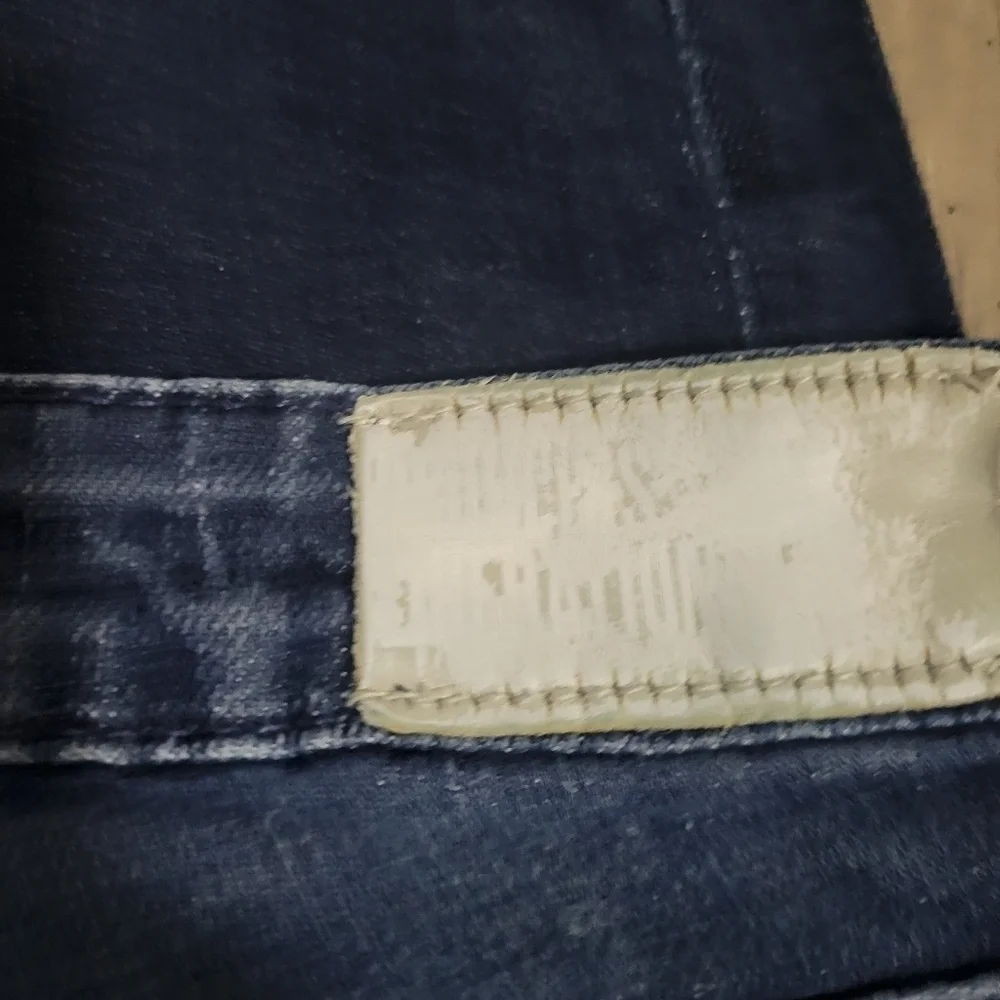 People's Liberation distressed skinny jeans size 25 with star pockets